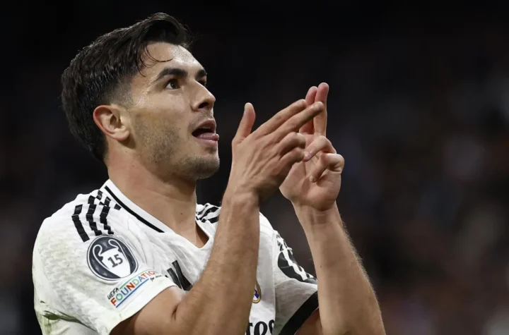 Brahim Díaz celebrates a goal for Real Madrid with a finger-guns gesture.