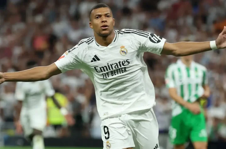 Kylian Mbappé celebrating a goal for Real Madrid at Santiago Bernabéu