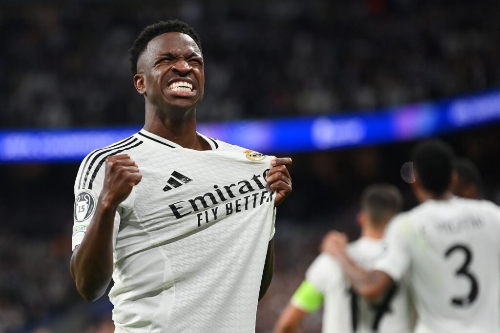 Vinícius Jr celebrating a goal for Real Madrid with arms wide- Vinicius Jr contract