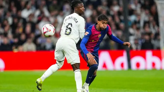 Real Madrid and Barcelona players battle for the ball as ticket prices for El Clasico at Camp Nou draw attention