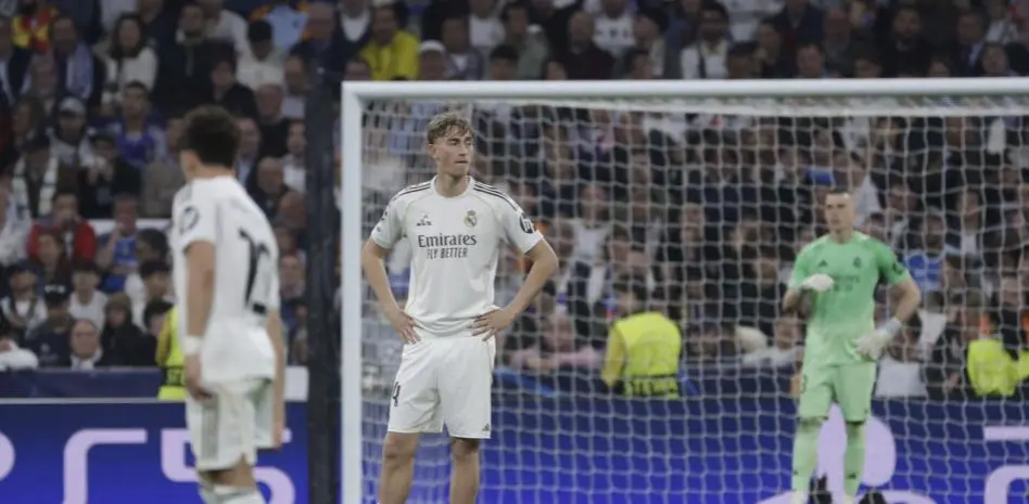 Dean Huijsen stands with hands on hips in front of goal during a tense match moment