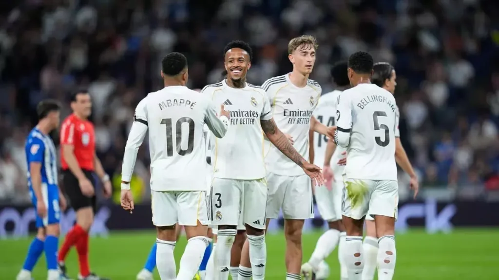 Real Madrid players celebrate on the pitch before the Betis match as lineup questions grow