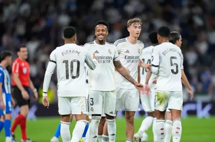 Real Madrid players celebrate on the pitch before the Betis match as lineup questions grow