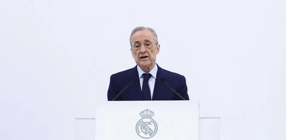 Club official speaks at a podium with the Real Madrid crest during an institutional appearance