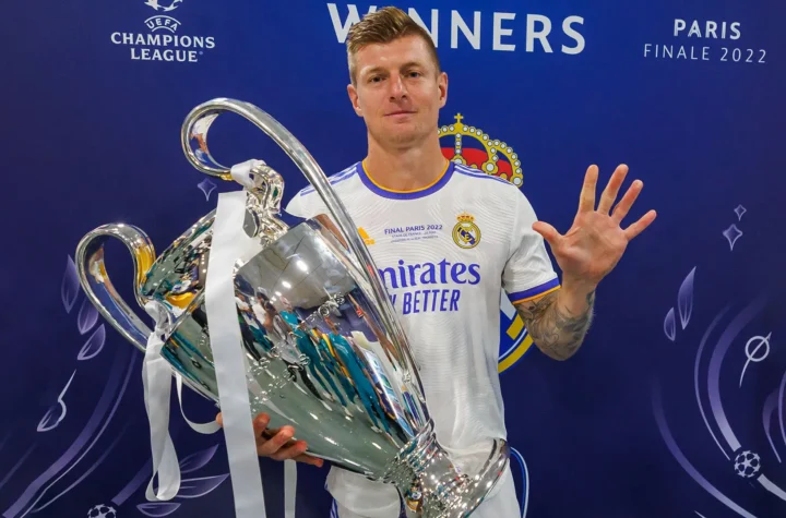 Toni Kroos Real Madrid return story showing a player with the Champions League trophy