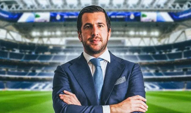 Enrique Riquelme Real Madrid elections story graphic showing a suited man in a stadium