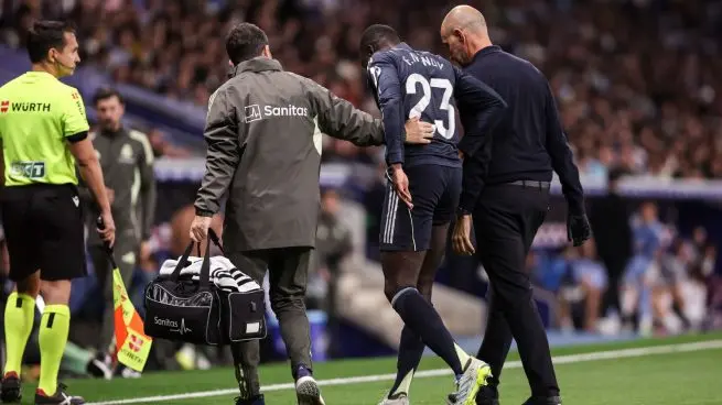 Ferland Mendy injury forces the Real Madrid defender off the pitch with medical staff during a match.