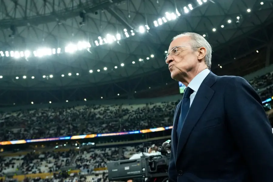 Senior Real Madrid official standing inside a stadium during a tense moment for the club