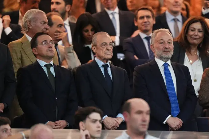 Featured image for Florentino Perez fans and socios coverage showing senior club figures standing among spectators at a high-profile event