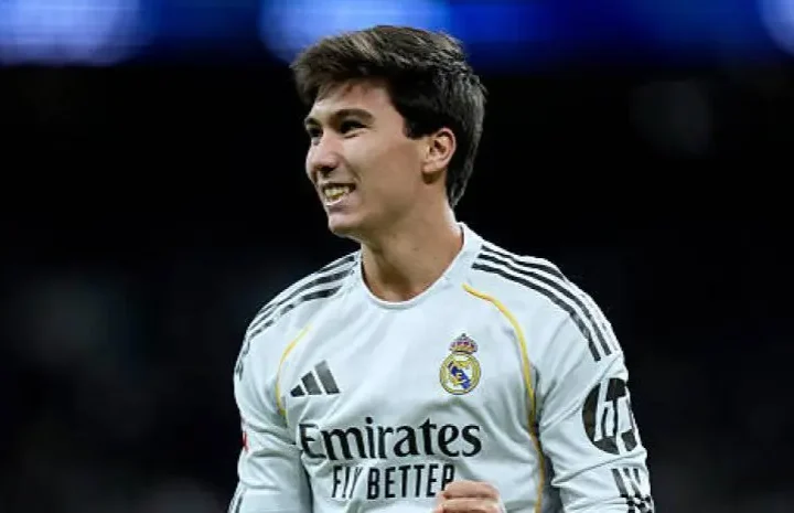 Gonzalo Garcia Real Madrid article image showing a smiling Real Madrid player in a white kit during the Oviedo match