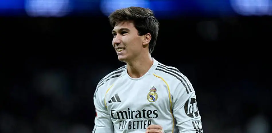 Gonzalo Garcia Real Madrid article image showing a smiling Real Madrid player in a white kit during the Oviedo match