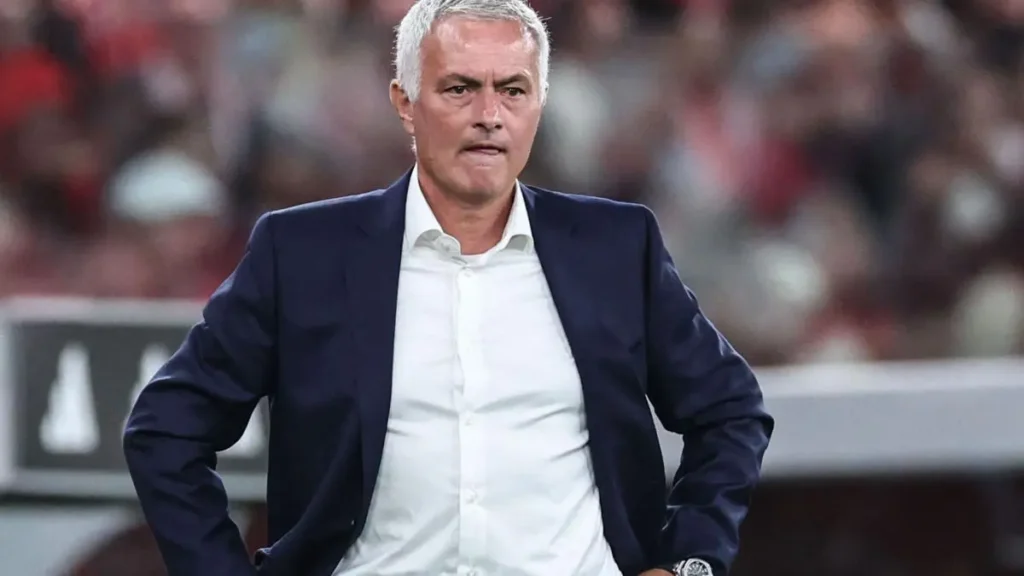 Jose Mourinho Real Madrid return feature image showing a football coach standing on the touchline during a match