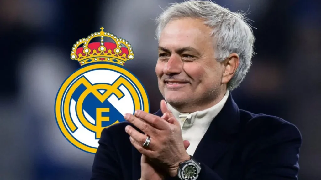 Jose Mourinho claps beside the Real Madrid crest as reports say his return to Real Madrid is reaching the final stages