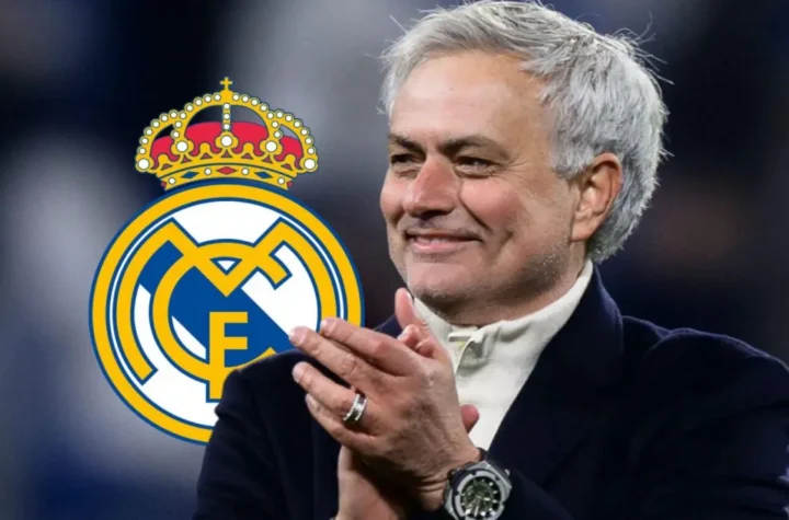 Jose Mourinho claps beside the Real Madrid crest as reports say his return to Real Madrid is reaching the final stages