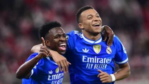 Kylian Mbappe Real Madrid criticism grows as the forward celebrates with a teammate in a Real Madrid match photo before Oviedo