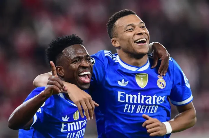 Kylian Mbappe Real Madrid criticism grows as the forward celebrates with a teammate in a Real Madrid match photo before Oviedo