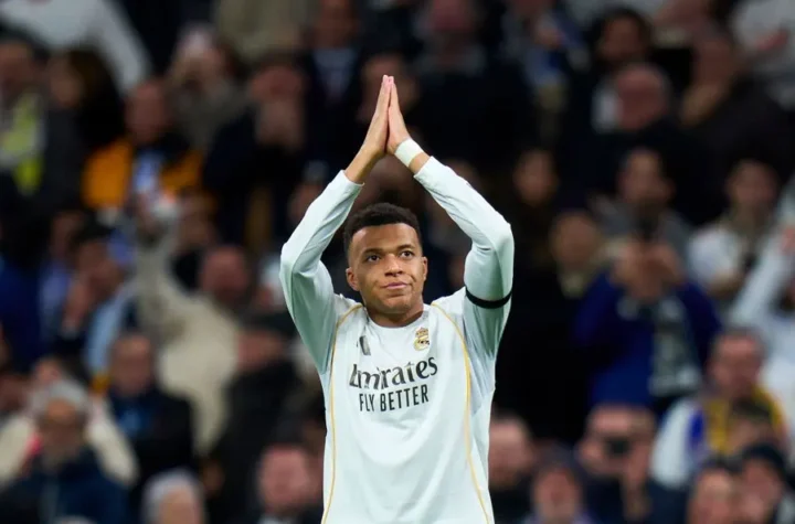 Kylian Mbappe Real Madrid forward applauds supporters during a match amid exit rumors, criticism, and questions about his squad role