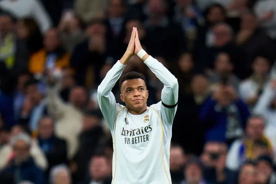 Kylian Mbappe Real Madrid forward applauds supporters during a match amid exit rumors, criticism, and questions about his squad role