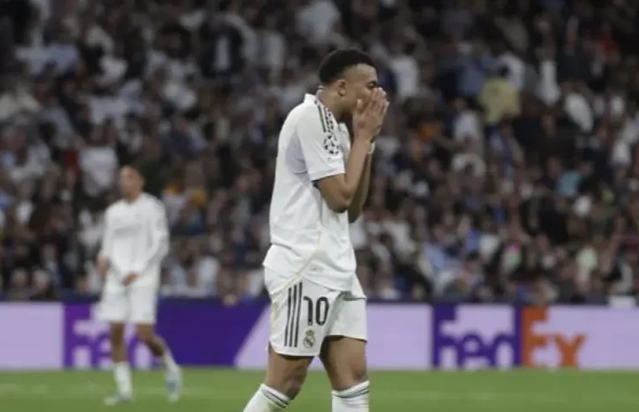 Real Madrid backs Mbappe story image showing a Real Madrid player reacting with frustration during a match