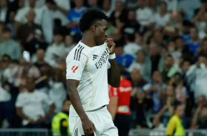 Real Madrid player kisses the club badge during the match against Espanyol