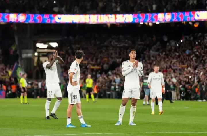 Real Madrid season review image showing Real Madrid players applauding supporters after a difficult away match