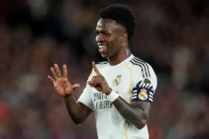 Vinicius Camp Nou gesture as a Real Madrid player makes a hand sign during El Clasico