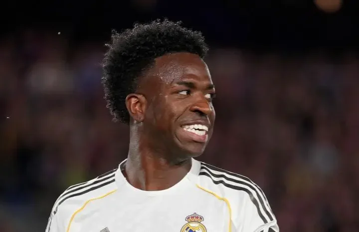 Vinicius anti-racism office story image showing the Real Madrid winger smiling in his white kit during a match