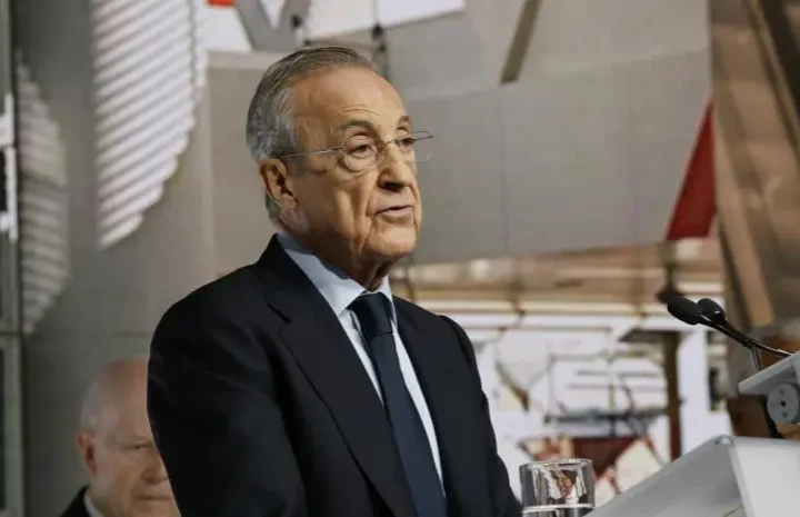 Why Florentino Perez will not attend El Clasico feature image showing a man speaking at a podium during an official event