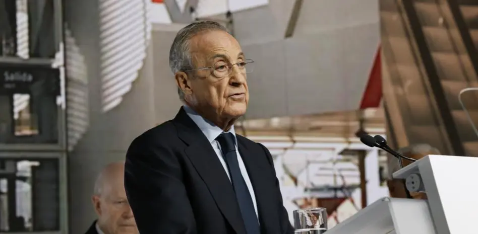 Why Florentino Perez will not attend El Clasico feature image showing a man speaking at a podium during an official event