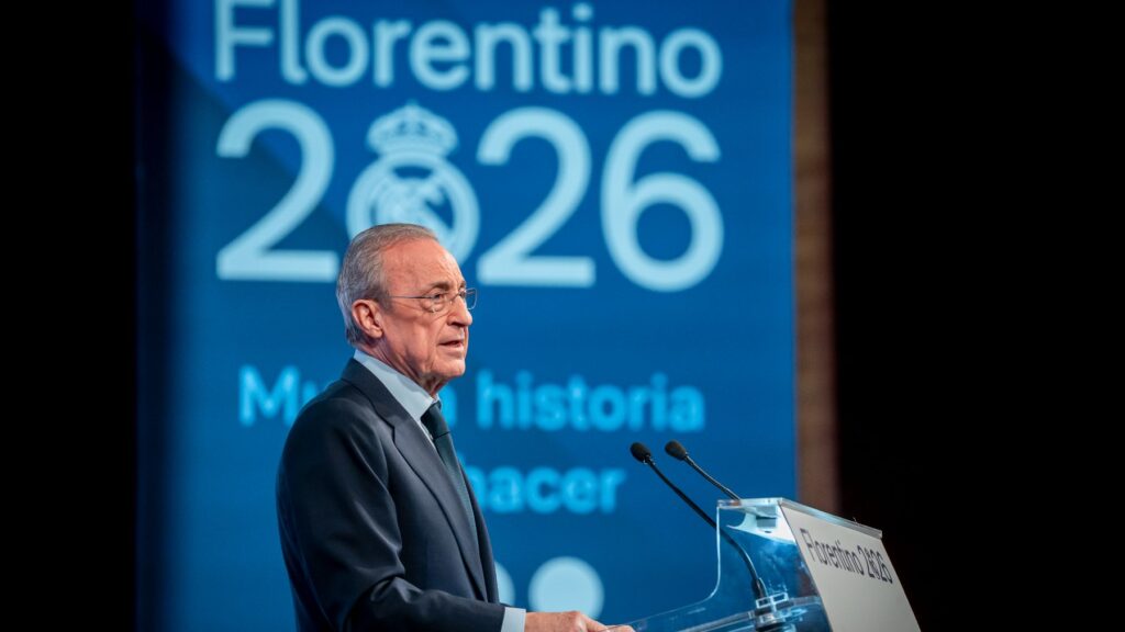 Florentino Pérez speaks at a podium in front of his 2026 campaign banner before the Real Madrid presidential election