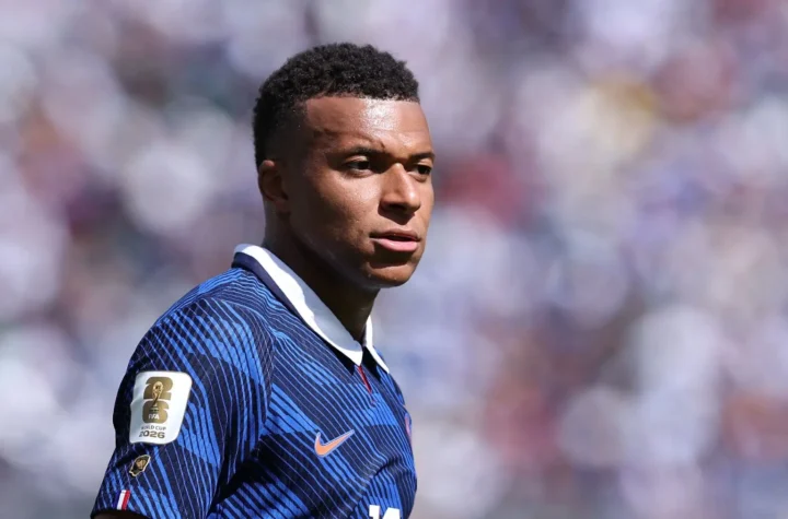 France player in a blue national team kit during a World Cup match