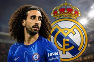 Marc Cucurella in a Chelsea shirt with the Real Madrid crest in the background