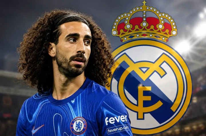 Marc Cucurella in a Chelsea shirt with the Real Madrid crest in the background