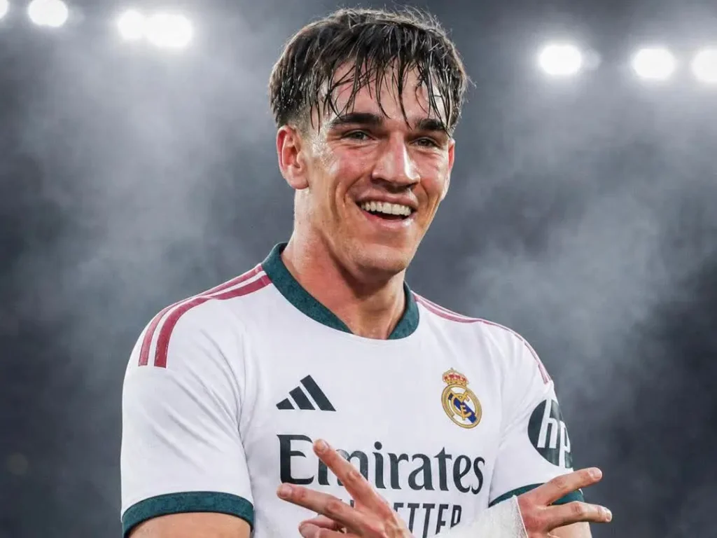 Smiling Real Madrid player under stadium lights for the Carlos Espí Real Madrid transfer story.