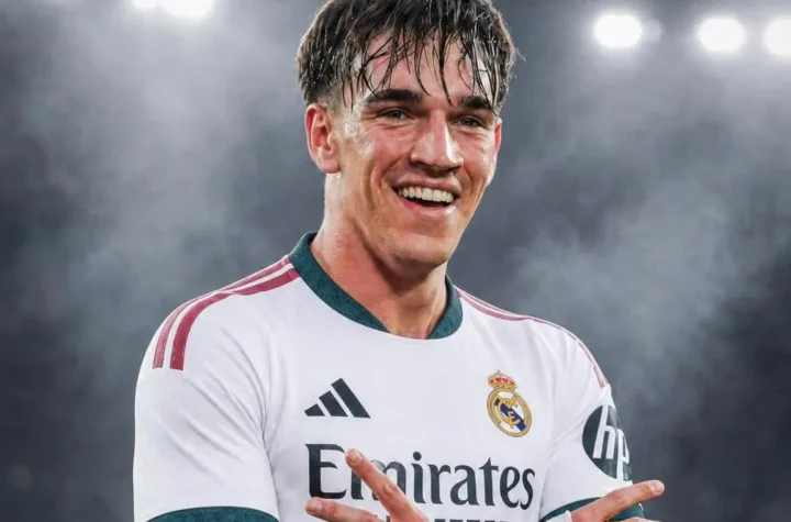Smiling Real Madrid player under stadium lights for the Carlos Espí Real Madrid transfer story.