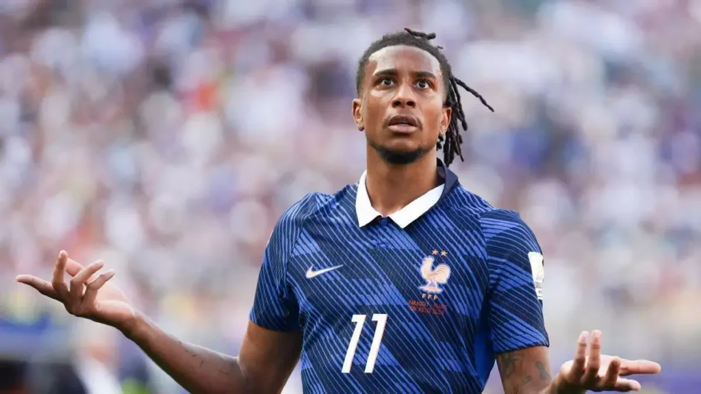 Michael Olise Real Madrid featured image showing a footballer in a France national team jersey during a transfer story