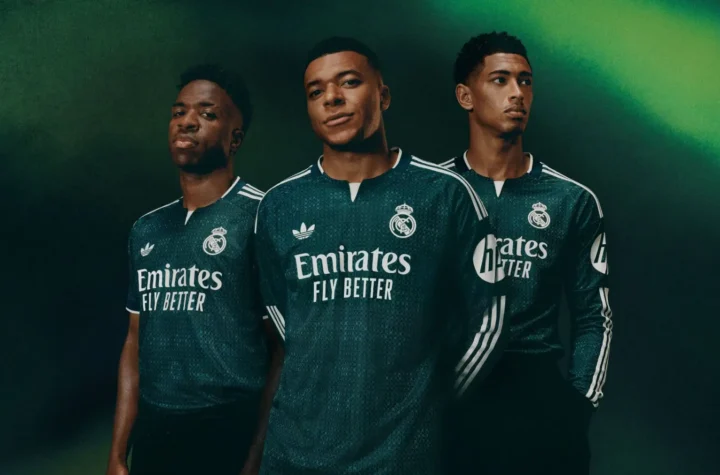 Real Madrid second kit in dark green shown on three players during the 2026-27 away kit launch