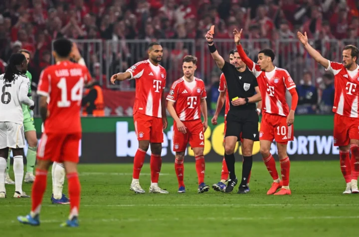 Slavko Vincic Real Madrid featured image showing the referee issuing a red card during Bayern Munich vs Real Madrid