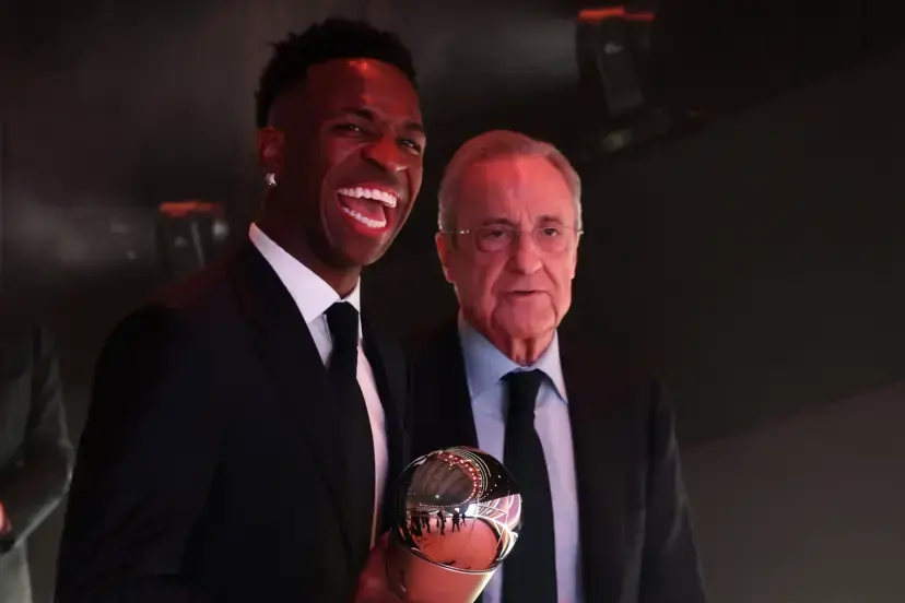 Vinicius Real Madrid renewal featured image showing a Real Madrid player posing with a club executive at an awards event